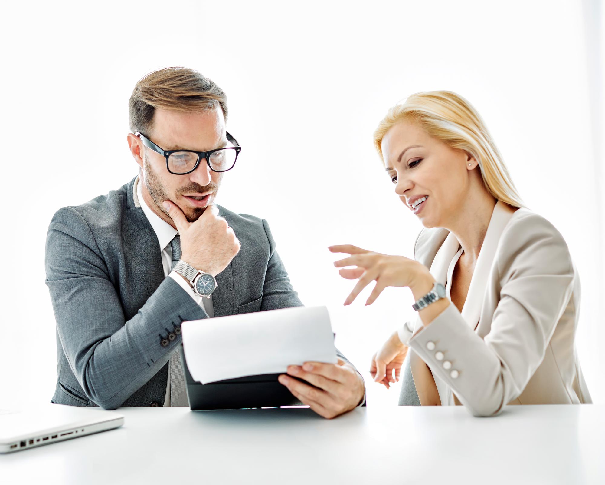 advisor speaking with client over documents